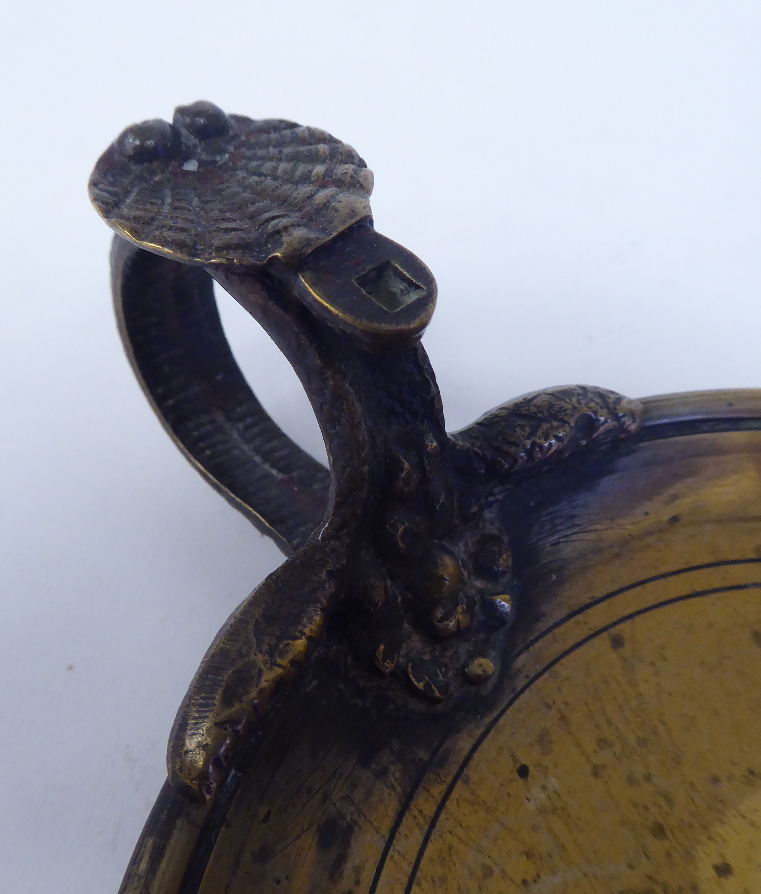 A Victorian brass chamberstick with a coiled snake handle and shell cast tab  bears a Queen Victoria - Image 3 of 5