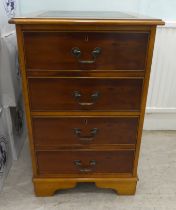 A modern yewwood two drawer filing cabinet, on a plinth  31.5"h  20.5"w  23"deep