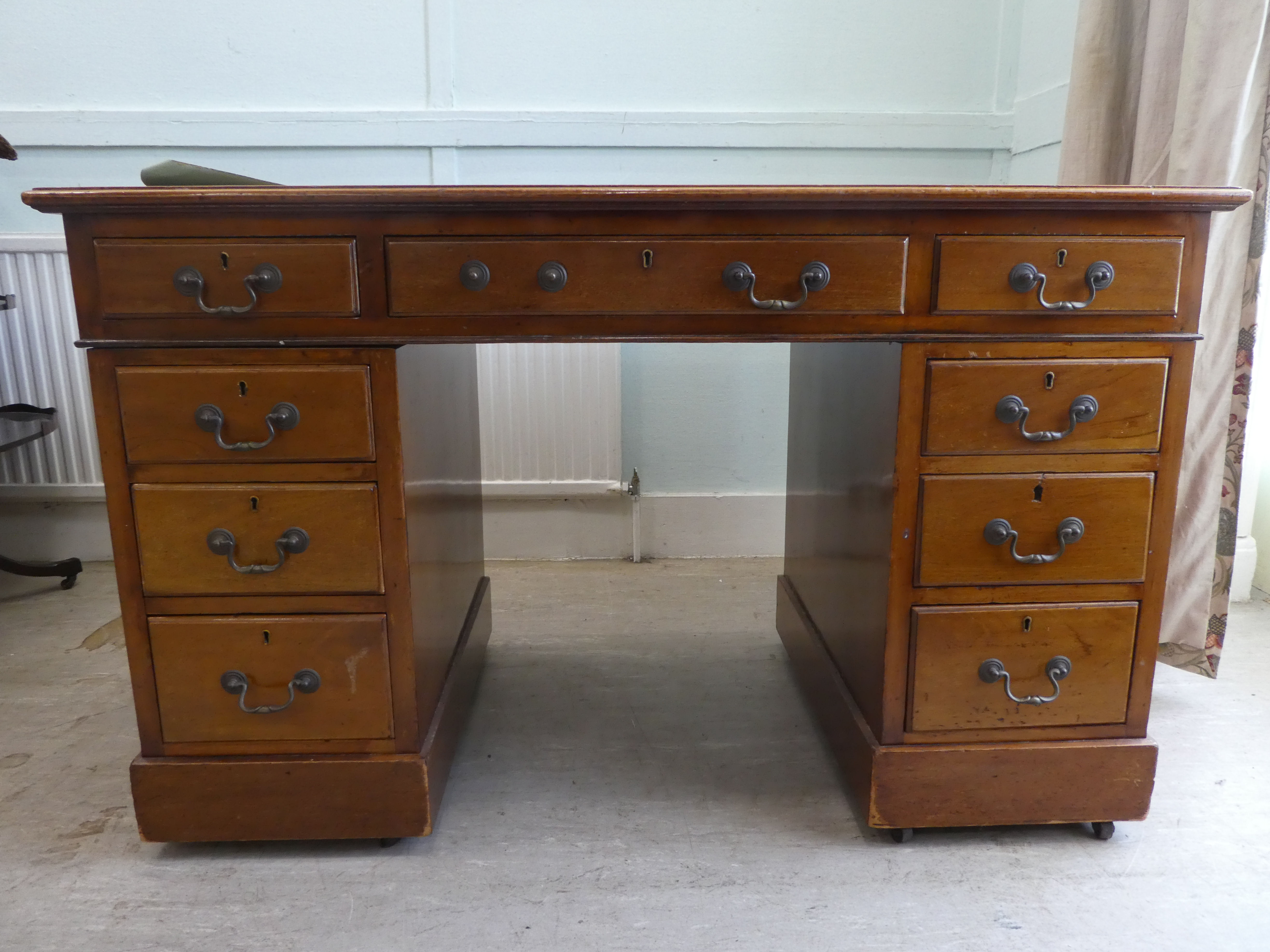 A late 19thC mahogany nine drawer, twin pedestal desk  29"h  48"w