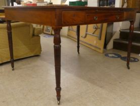 A late Victorian mahogany library table with a tooled and gilded hide scriber, over an arrangement