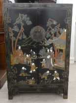 A modern Japanese design black lacquered side cabinet with two doors, decorated in traditional taste