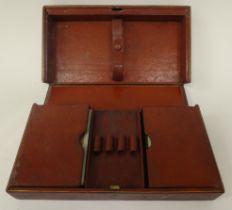 A Cartier Ltd, London gilded red and brown hide Bridge box, fashioned as a book with a fitted