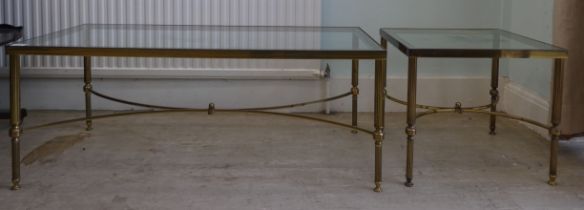 A 1980s lacquered brass framed coffee table with a glass insert, raised on tubular fluted legs  16"h