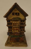 A 1920s Cecil Aldin porcelain night light, fashioned as a Mediaeval townhouse  bears a moulded