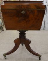 A reproduction of a George III mahogany cellarette of sarcophagus form, on a turned column and