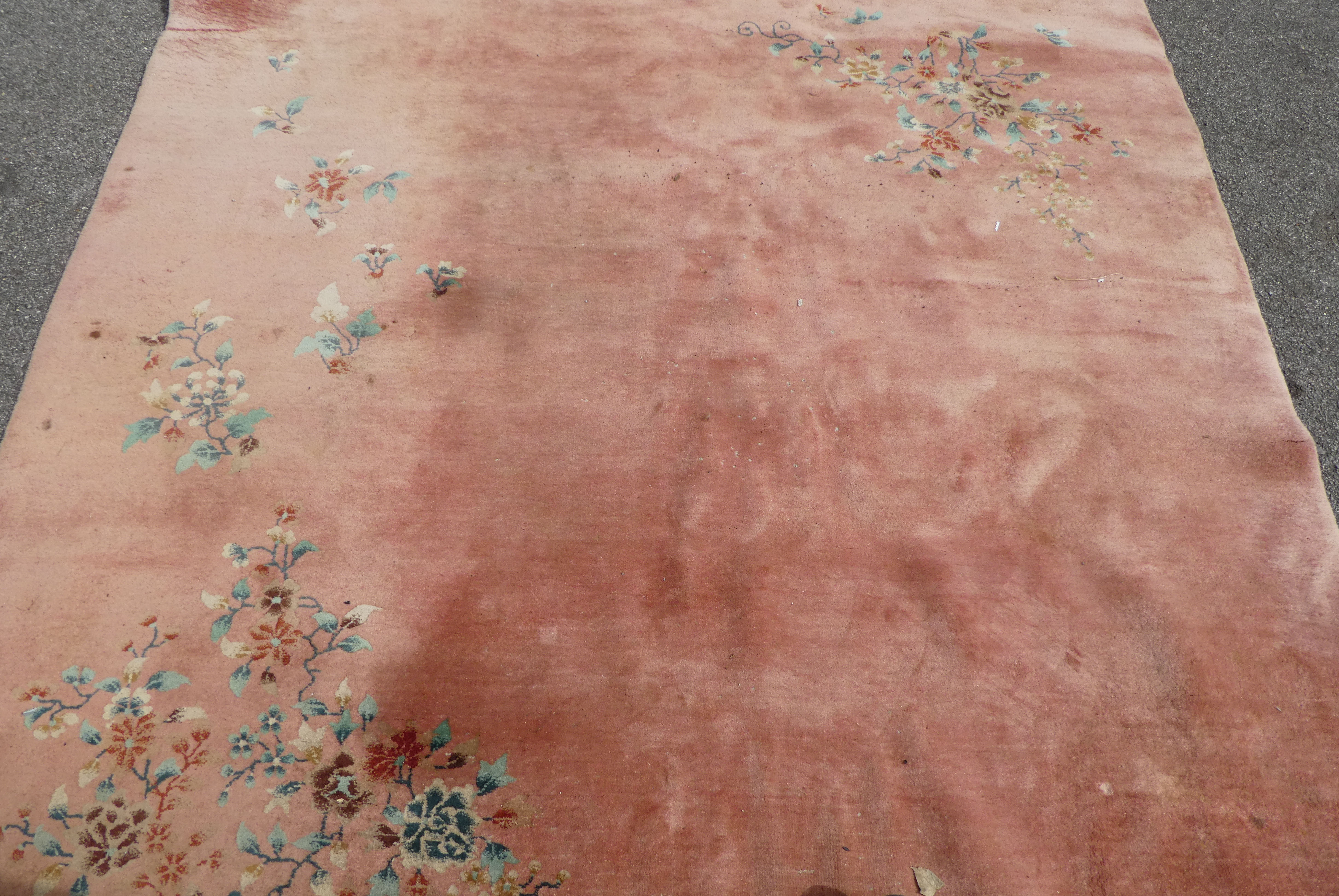 A Chinese washed woollen rug, decorated with flora, on a salmon pink coloured ground  100" x 148" - Image 3 of 7