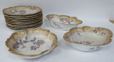 Limoges porcelain tableware, decorated with pastel coloured flowers and gilt banding