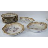 Limoges porcelain tableware, decorated with pastel coloured flowers and gilt banding