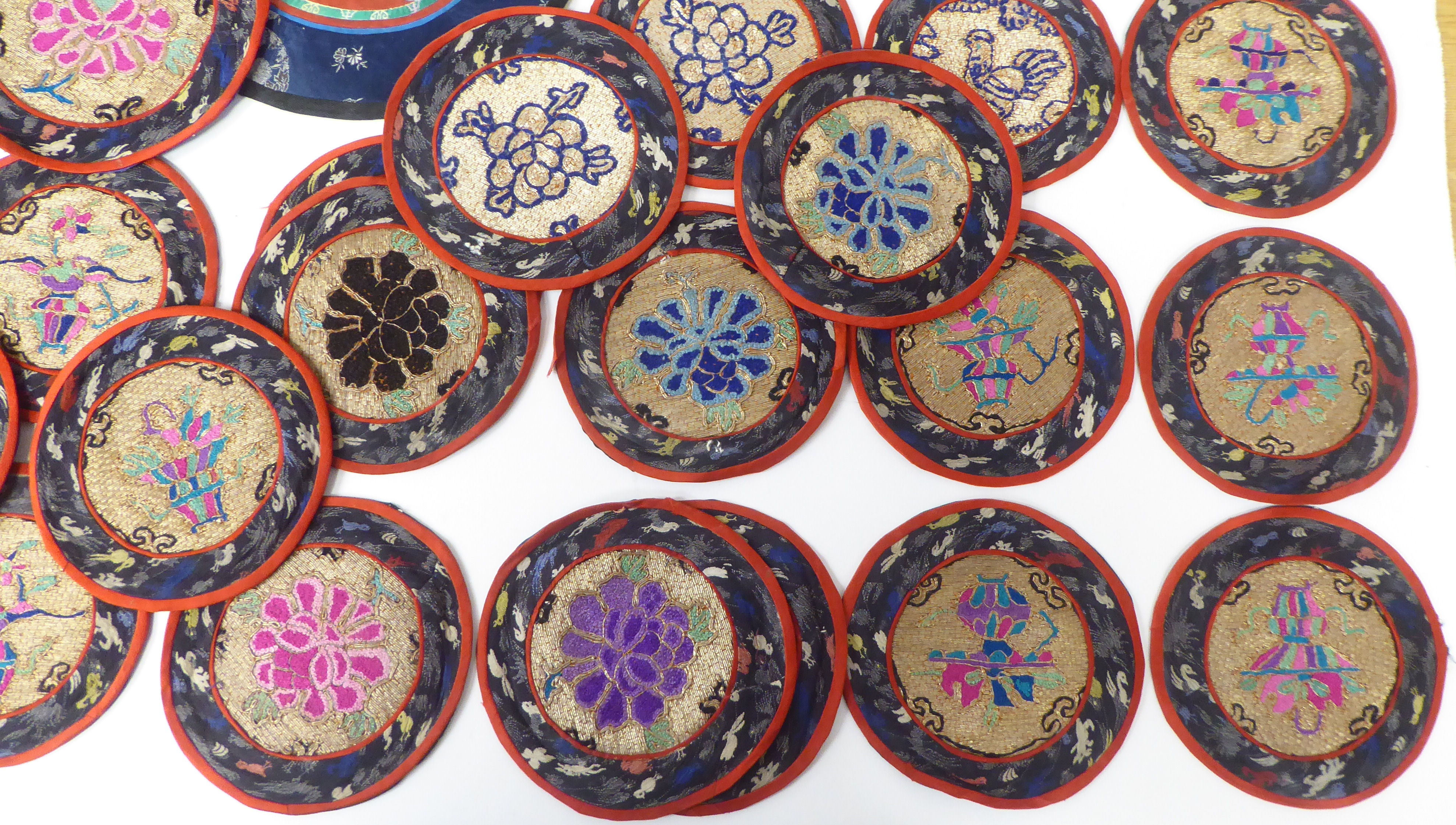 Approx. thirty 20thC Chinese fabric roundel table mats, embroidered in coloured silk and yellow - Image 5 of 5