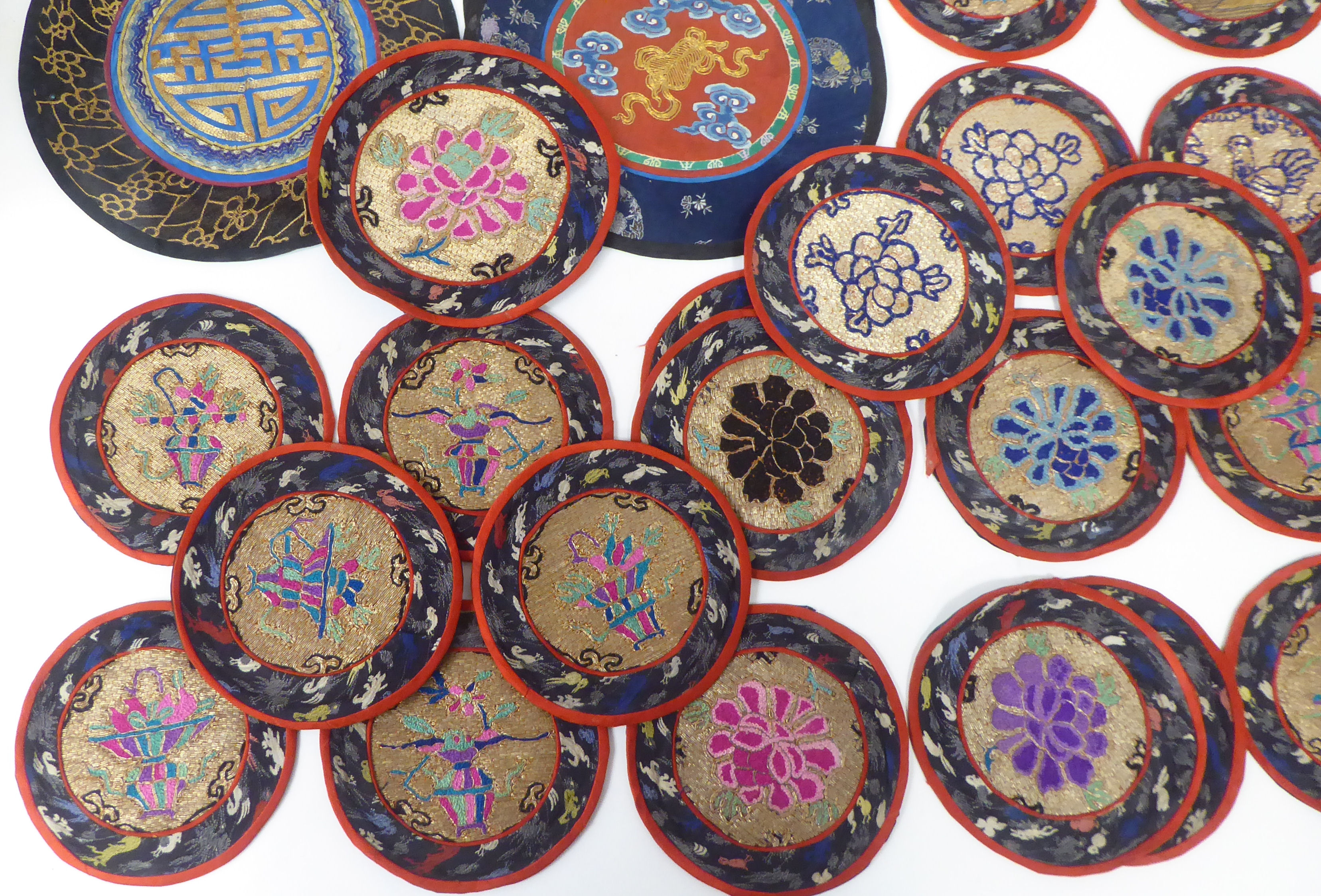 Approx. thirty 20thC Chinese fabric roundel table mats, embroidered in coloured silk and yellow - Image 3 of 5