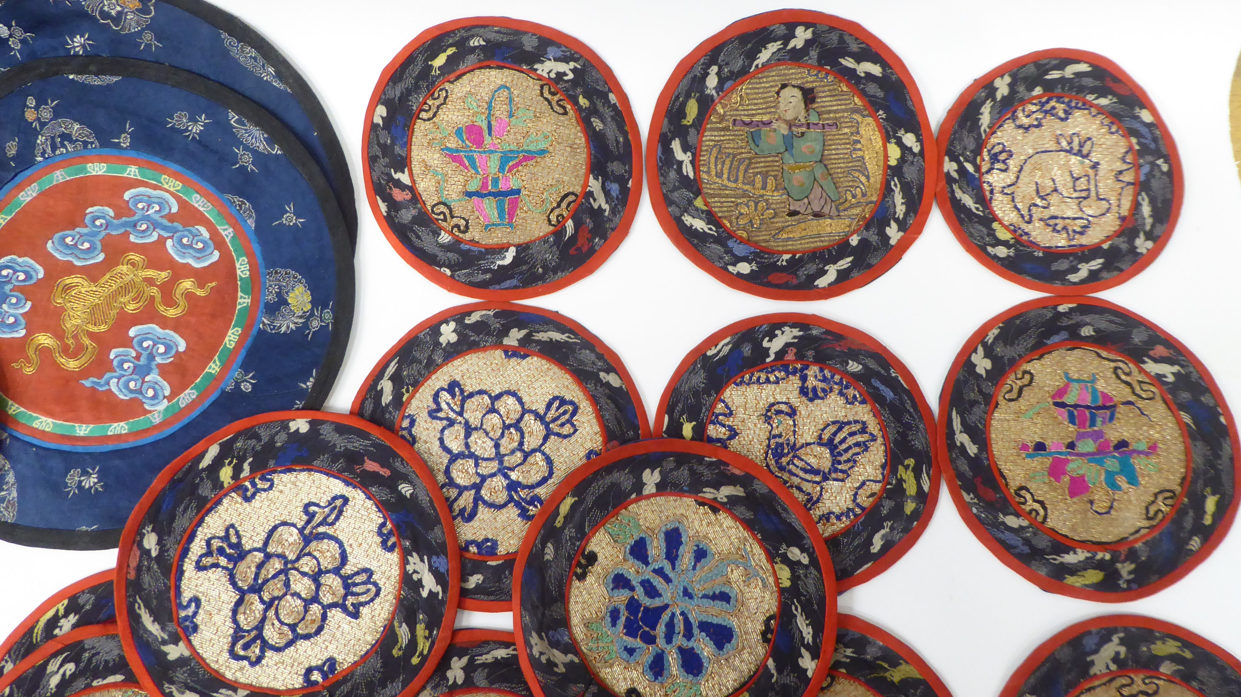 Approx. thirty 20thC Chinese fabric roundel table mats, embroidered in coloured silk and yellow - Image 4 of 5