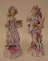 A pair of 20thC Continental porcelain figures, one an itinerant entertainer wearing a tricorn hat,