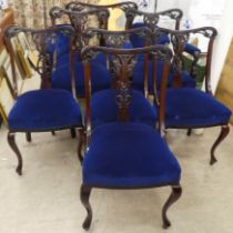 An Edwardian mahogany showwood framed salon suite  comprising a two person settee and six chairs,