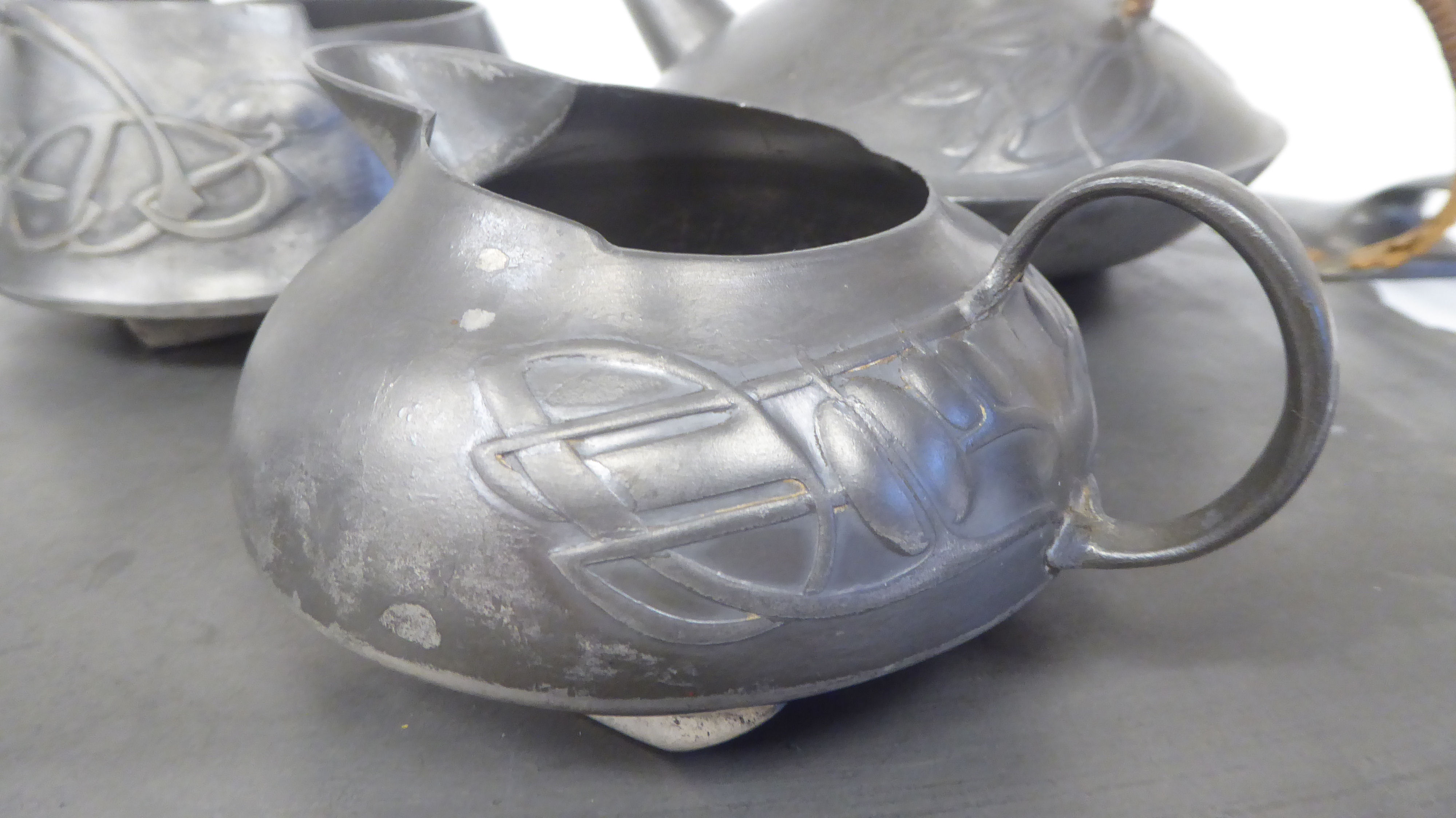 A Liberty & Co Tudric pewter three piece tea set of squat, bulbous form, designed by - Image 2 of 8