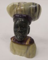 An African native carved, multi-coloured stone male bust  bears an indistinct signature  3.5"h