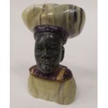 An African native carved, multi-coloured stone male bust  bears an indistinct signature  3.5"h