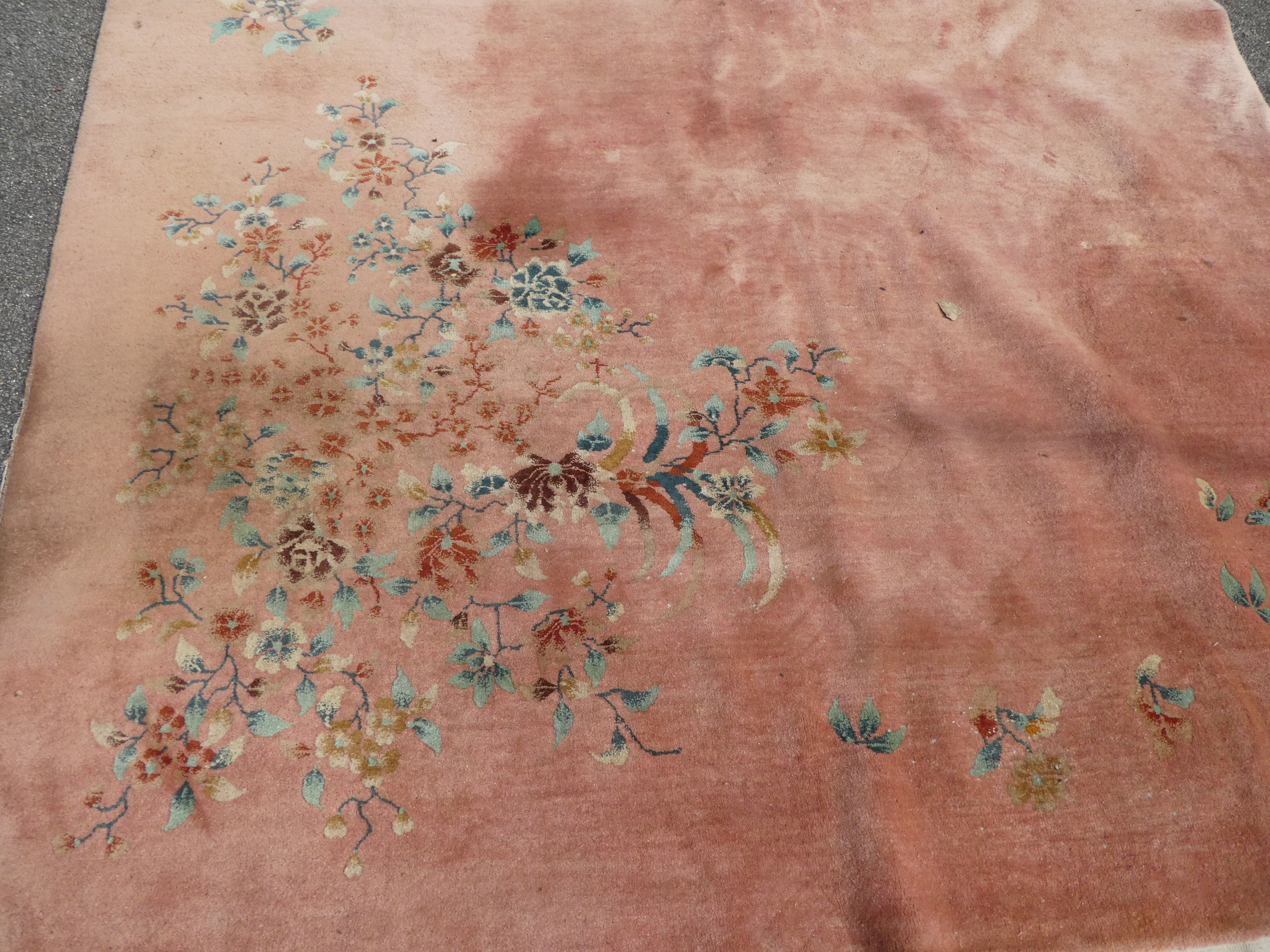 A Chinese washed woollen rug, decorated with flora, on a salmon pink coloured ground  100" x 148" - Image 5 of 7