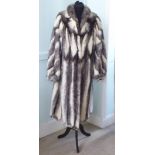 A lady's Dasco Black Cross, full-length grey and white fur coat with a rolled collar