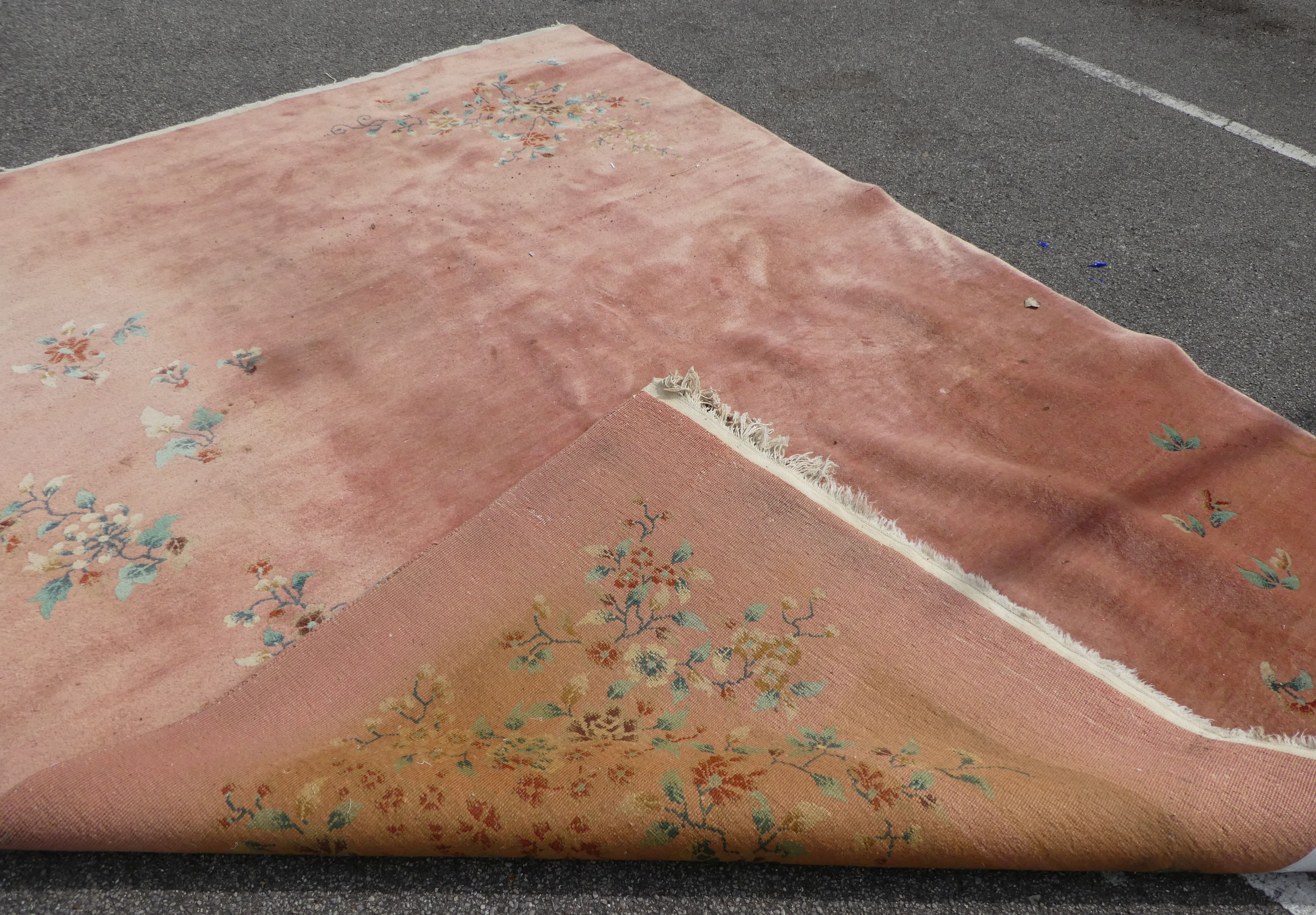 A Chinese washed woollen rug, decorated with flora, on a salmon pink coloured ground  100" x 148" - Image 7 of 7