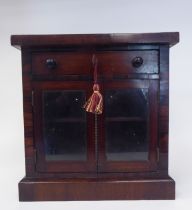 An early Victorian rosewood tabletop collector's cabinet, fashioned as a miniature chiffonier, the
