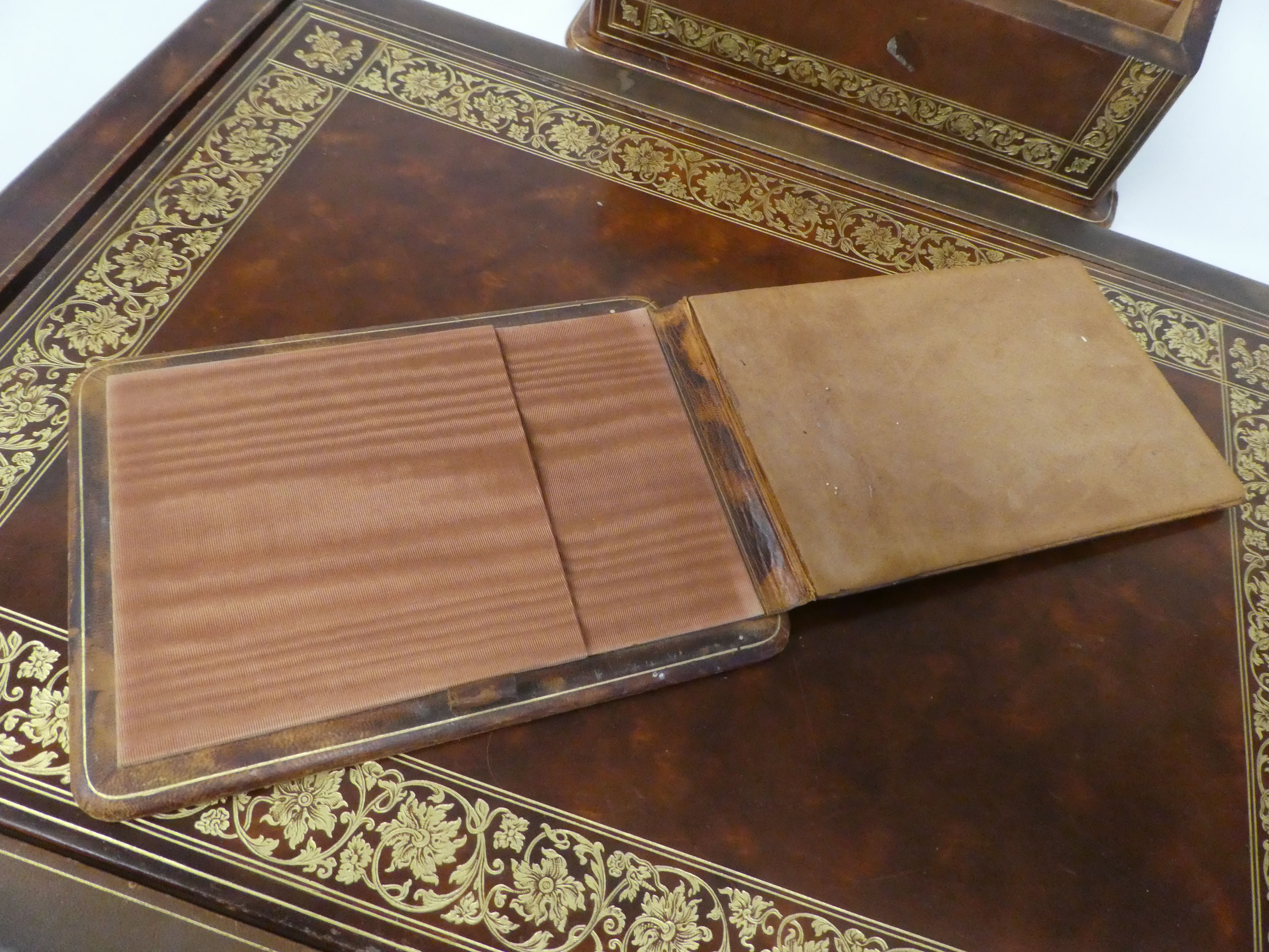 A Liberty gilded and burnished brown hide covered desk set, comprising a two-part blotter  19" x - Image 3 of 8