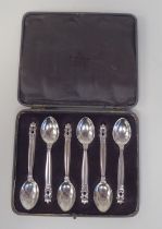 A set of six Georg Jensen silver teaspoons with scrolled terminals  stamped 925  cased