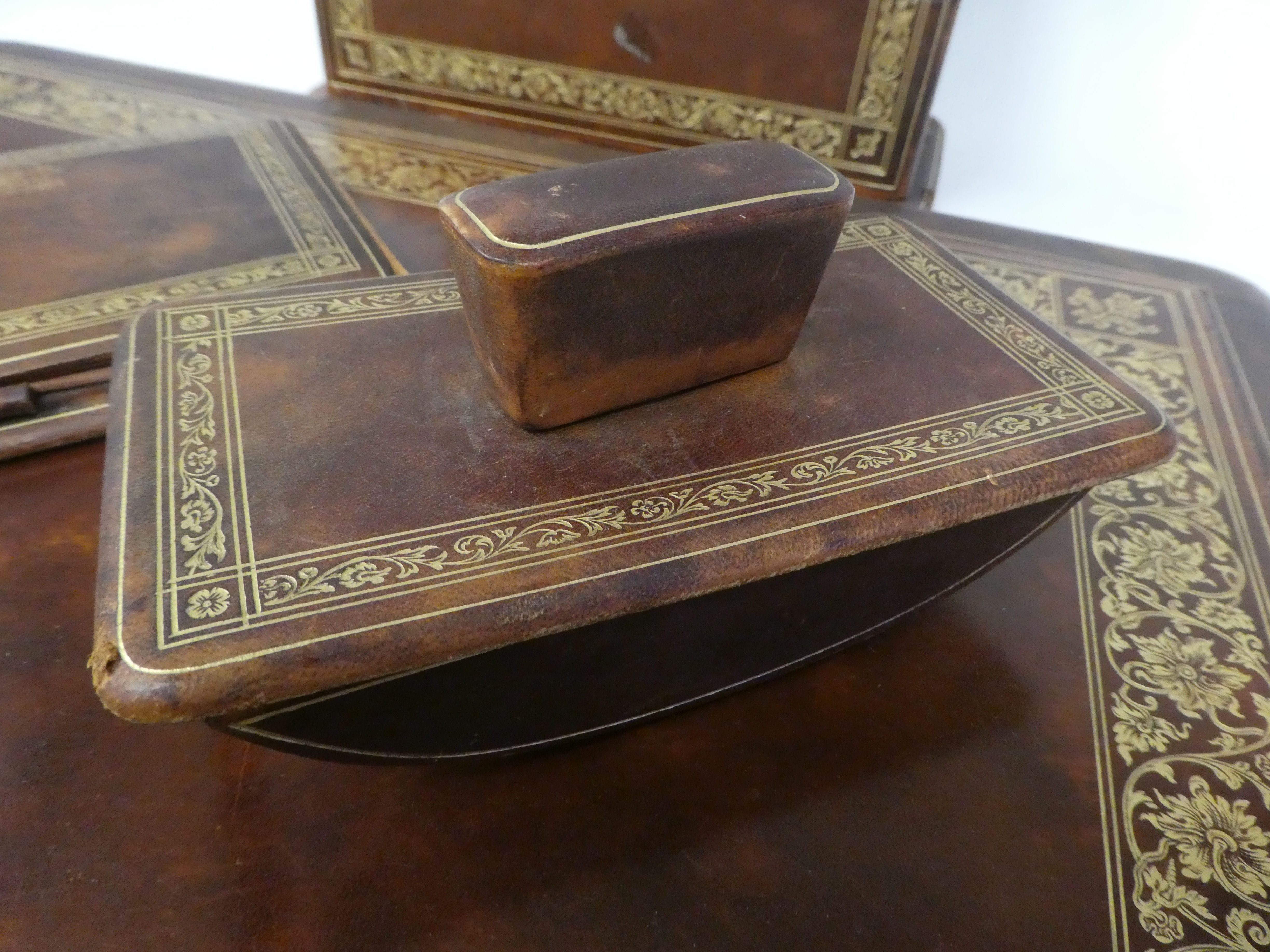 A Liberty gilded and burnished brown hide covered desk set, comprising a two-part blotter  19" x - Image 2 of 8