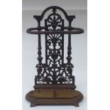 A late Victorian cast iron stickstand, the pierced upstand decorated with vase and floral