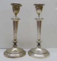 A pair of loaded silver candlesticks  Elkington & Co  London 1910  10"h