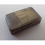 A Victorian silver and parcel gilt vinaigrette of rectangular form with engine turned decoration and