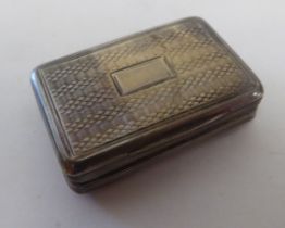 A Victorian silver and parcel gilt vinaigrette of rectangular form with engine turned decoration and