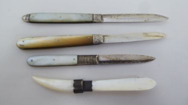 Early 20thC pocket knives, one with a folding silver blade and a mother-of-pearl clad handle