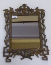 A 20thC mirror, set in a textured and decoratively cast frame, incorporating exotic birds  17" x 12"