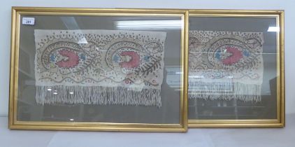 A pair of antique tasselled garment remnants, embroidered in colours  9" x 16"  framed