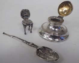 Silver collectables, viz. a spoon; a capstan design inkwell; and a miniature hall chair  mixed marks