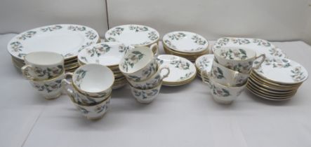 A Staffordshire bone china tea set, decorated in Christmas roses