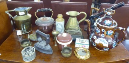 A mixed lot: to include a late Victorian gilded cast iron press; and a teapot