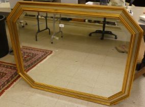 A modern octagonal mirror, the bevelled plate in a swept gilt frame  36" x 45"