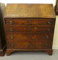 A George III satinwood and ebony inlaid mahogany bureau with a fall front, over four graduated