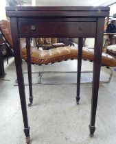 An early 20thC mahogany envelope design card table, incorporating four folding triangular flaps,