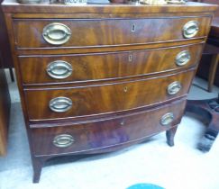 A mid/late 19thC mahogany bow front four drawer dressing chest, raised on bracket feet  32"h  33"w