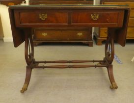 A 20thC mahogany finished sofa table, comprising two inline drawers and two facsimiles on the