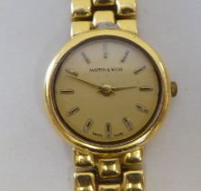 A lady's Mappin & Webb 18ct gold, round cased bracelet wristwatch, faced by a baton dial