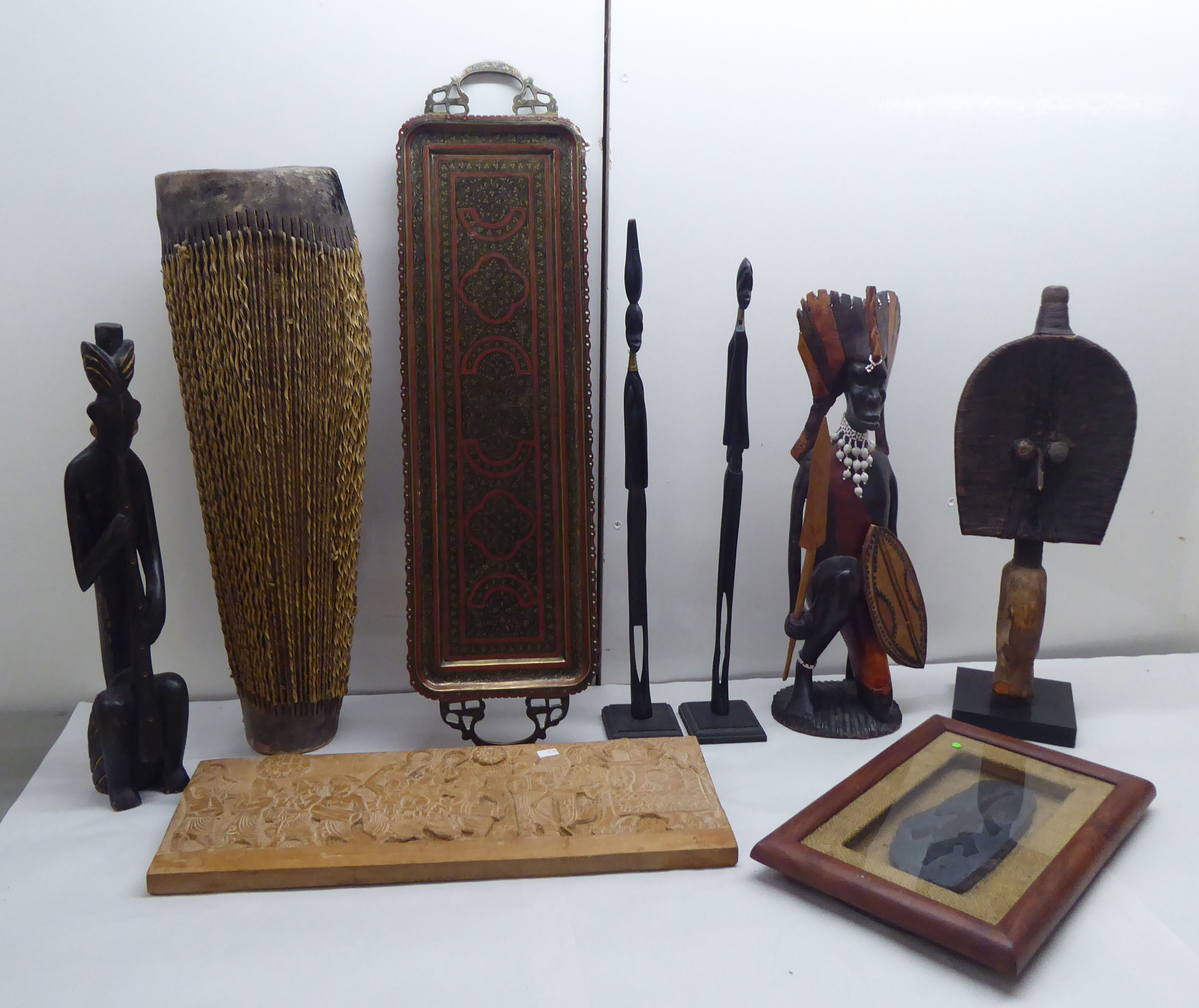 A mixed lot: to include African carved wooden figures  various sizes; and a hide covered drum  23"h