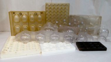 Modern clear and opaque plastic chocolate moulds: to include some for Easter eggs