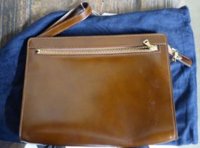 An Asprey stitched brown leather Riri clutch bag