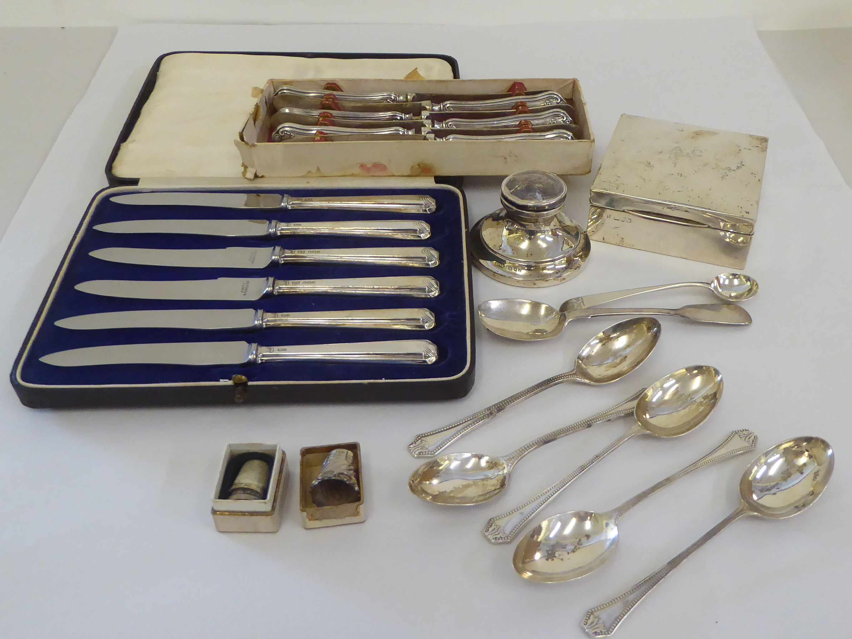 Two sets of six silver handled tea knives  cased; and other silver items  mixed marks