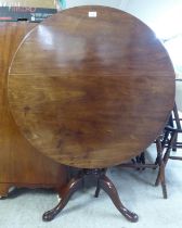 A George III mahogany pedestal table, raised on a tripod base and pad feet  28"h  35"dia