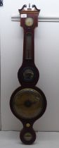 An early 19thC string inlaid mahogany cased wheel barometer, incorporating a hygrometer,