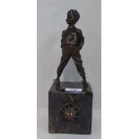 After Johann Ferdinind Preiss - a cast bronze 'Ski-Boy'  on a marble plinth with an applied Nazi
